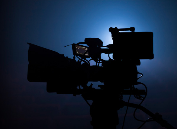 Camera on black stage