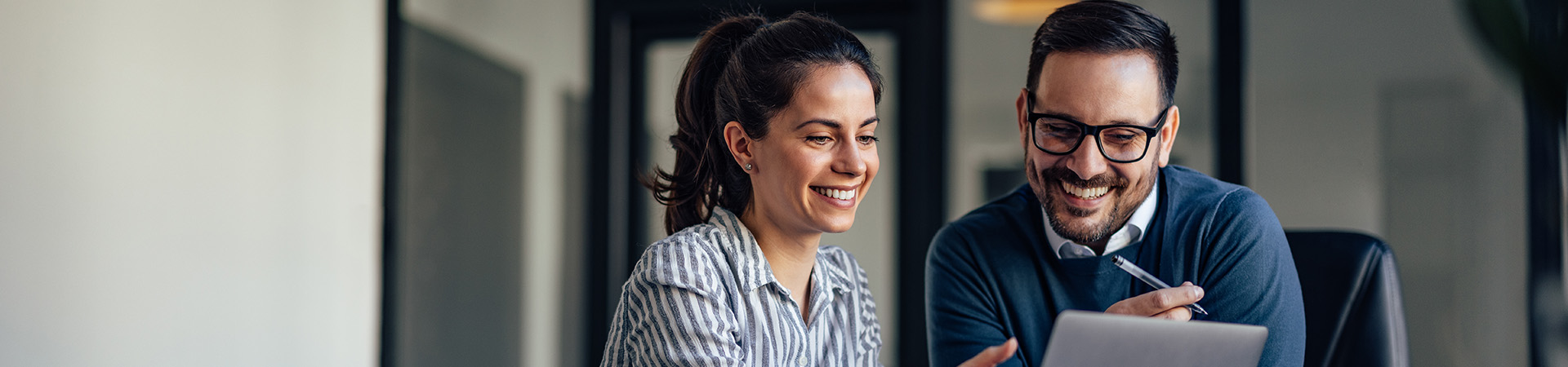 A colleague educating another on sustainable film travel